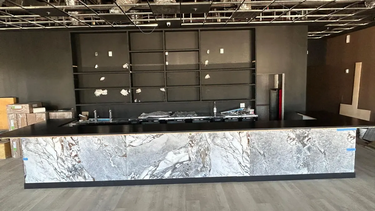 Exotic stone bar front with bold white and gray patterns in a restaurant