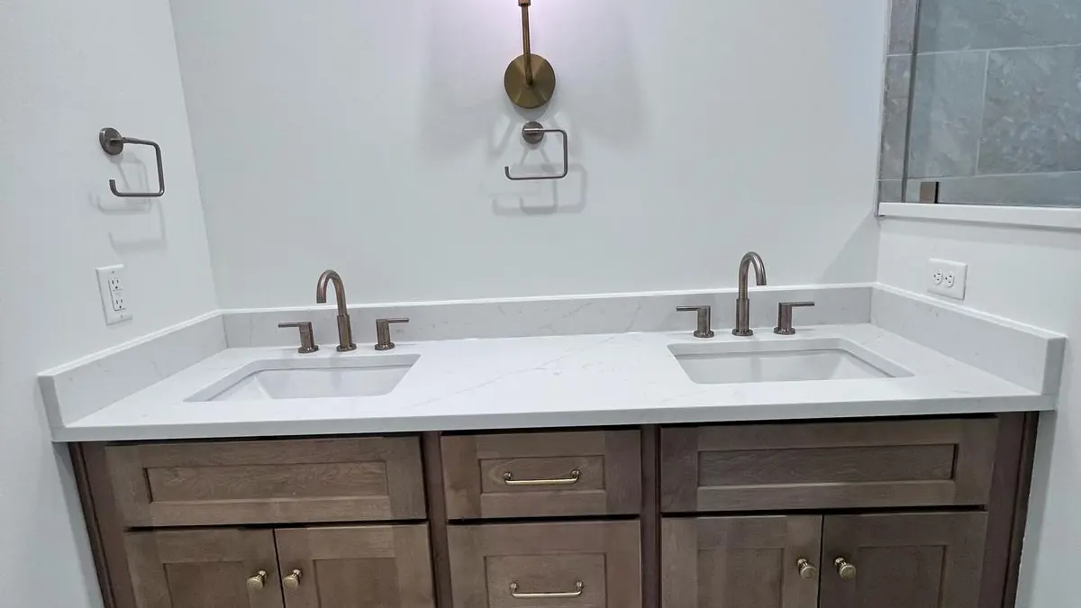 Modern bathroom vanity with a stone top and wood cabinet
