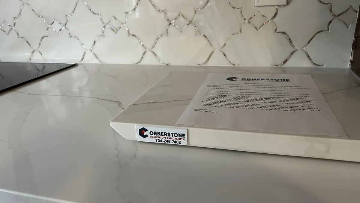 Cornerstone paperwork on a newly installed white quartz countertop