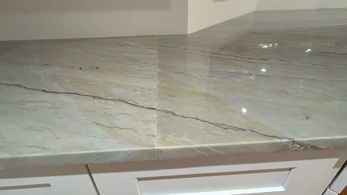 Close-up of a polished countertop edge on a quartzite kitchen counter