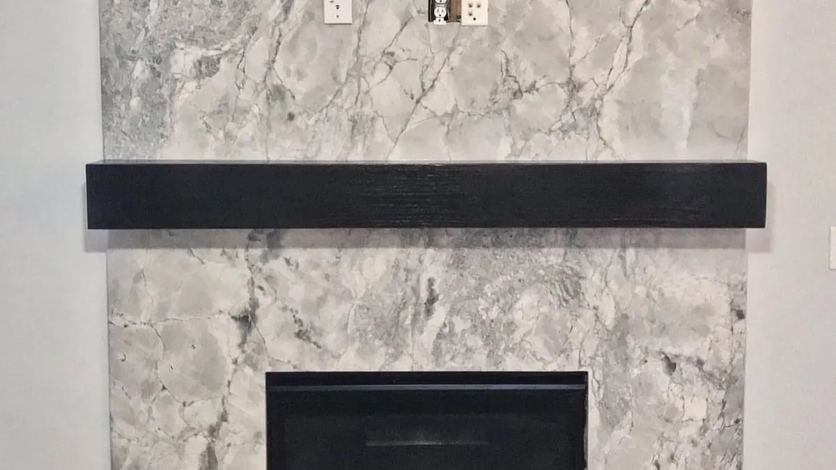 Stone fireplace with a surround, mantel and hearth