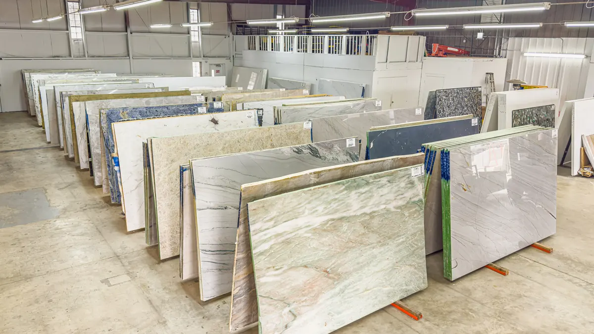 Full stone slabs standing in rows in the slab yard