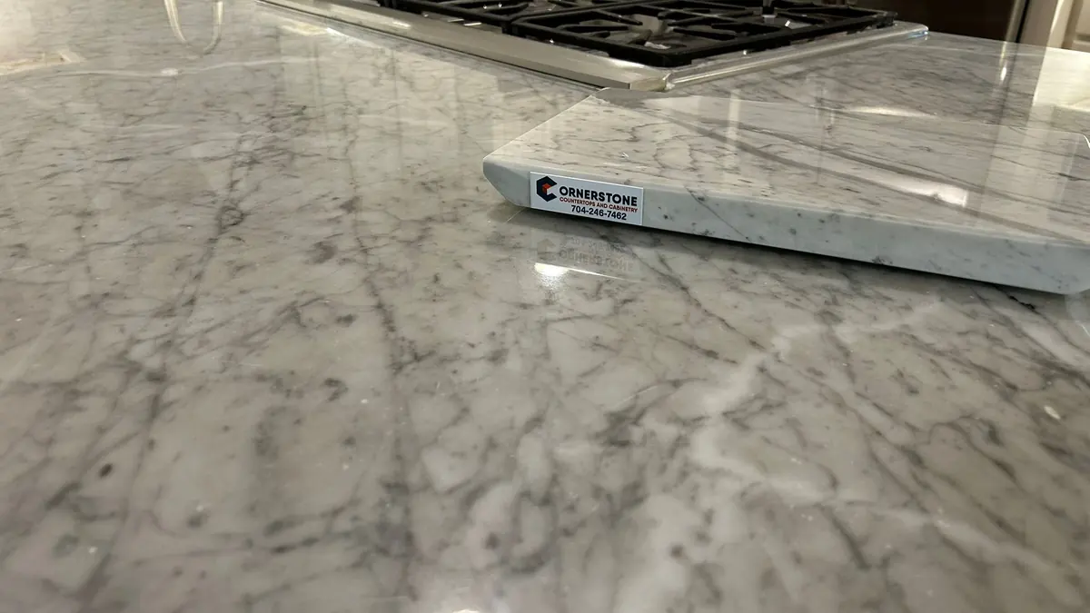 White marble-look countertop with gray veining in a kitchen
