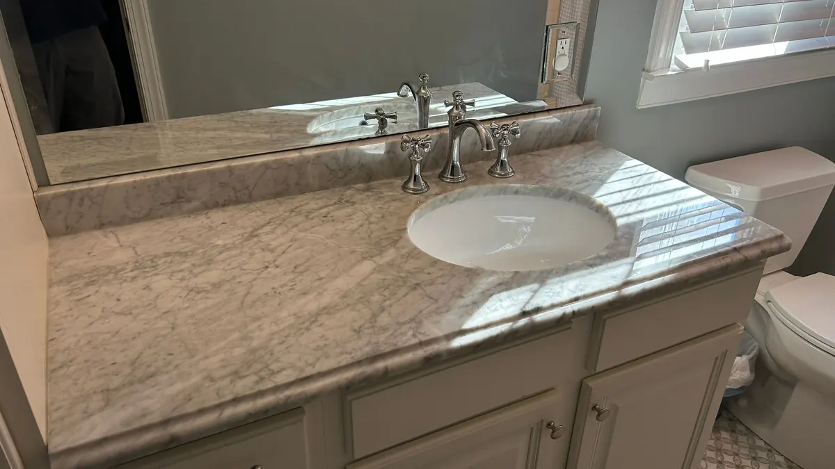 Natural stone bathroom vanity top with an oval sink