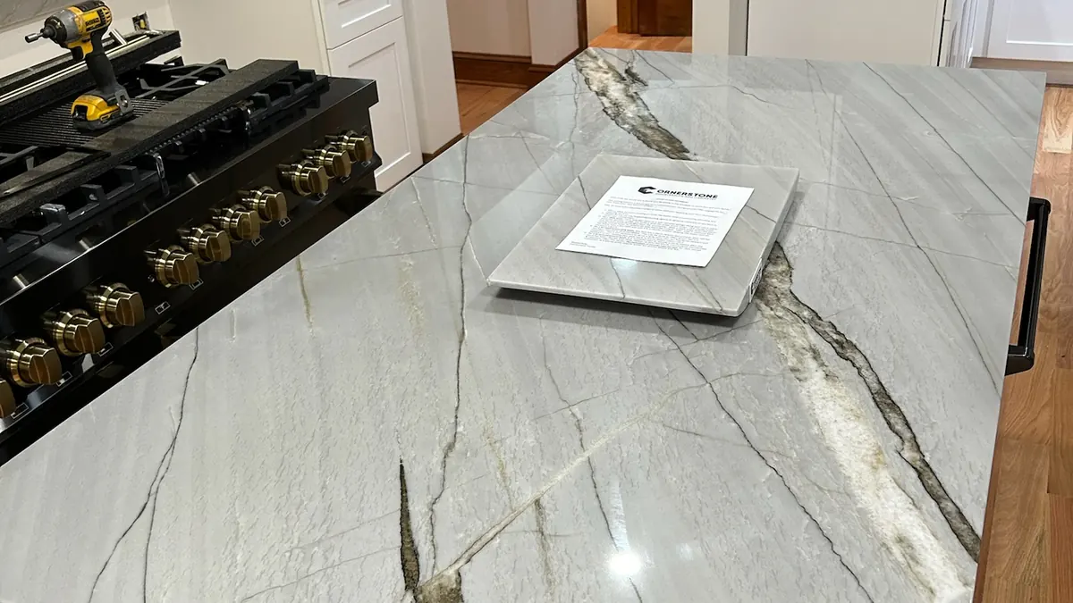 Quartzite kitchen island with dramatic gray and gold veins
