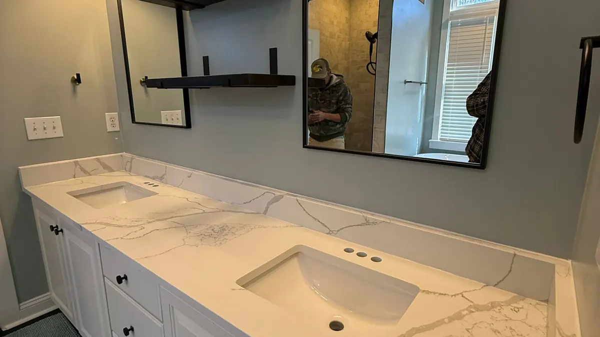 Double bathroom vanity with two sinks and a stone top