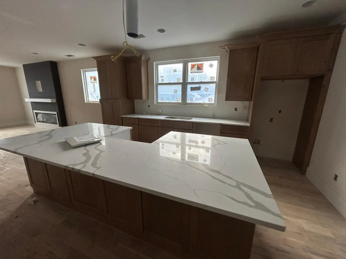 New stone countertop on a kitchen island with new cabinets