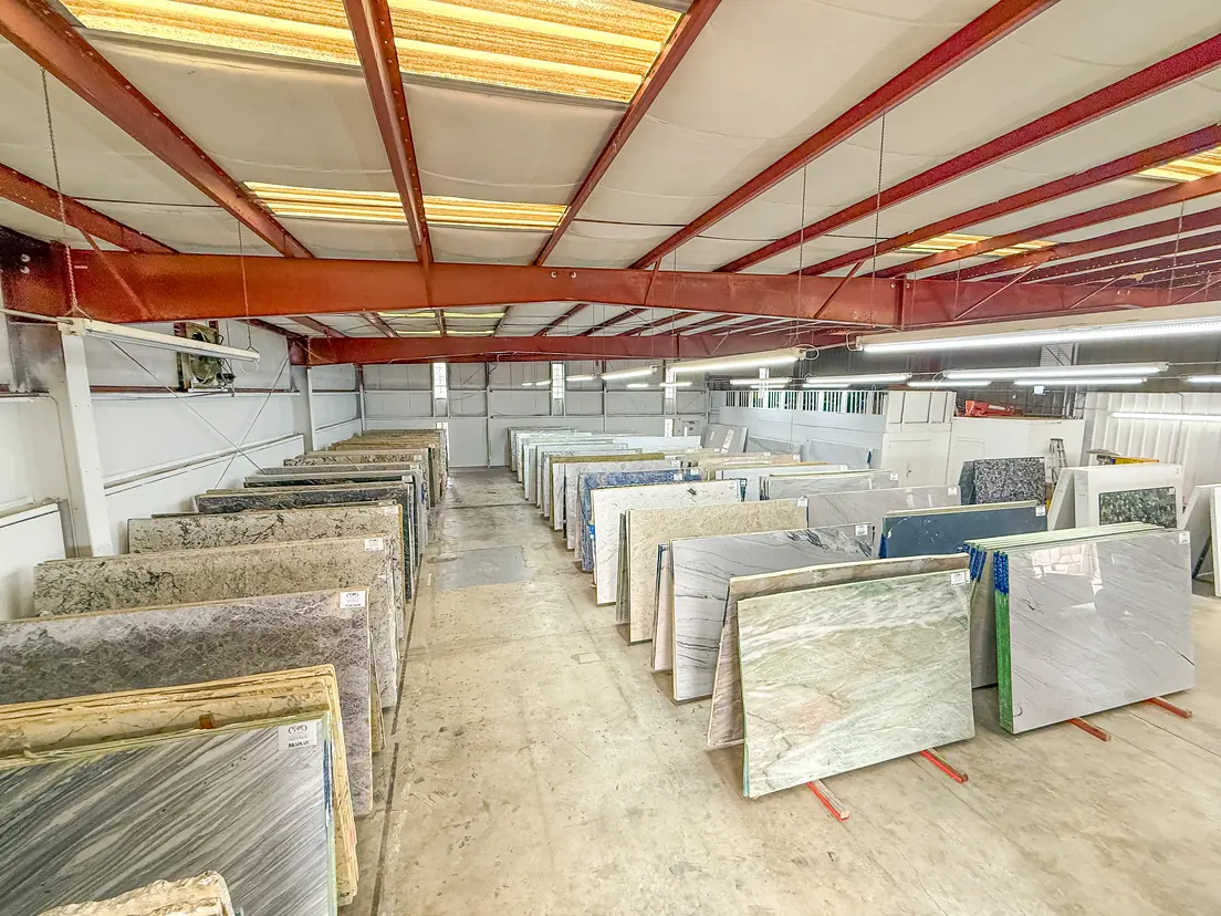 Rows of granite and quartzite slabs in the Cornerstone slab yard