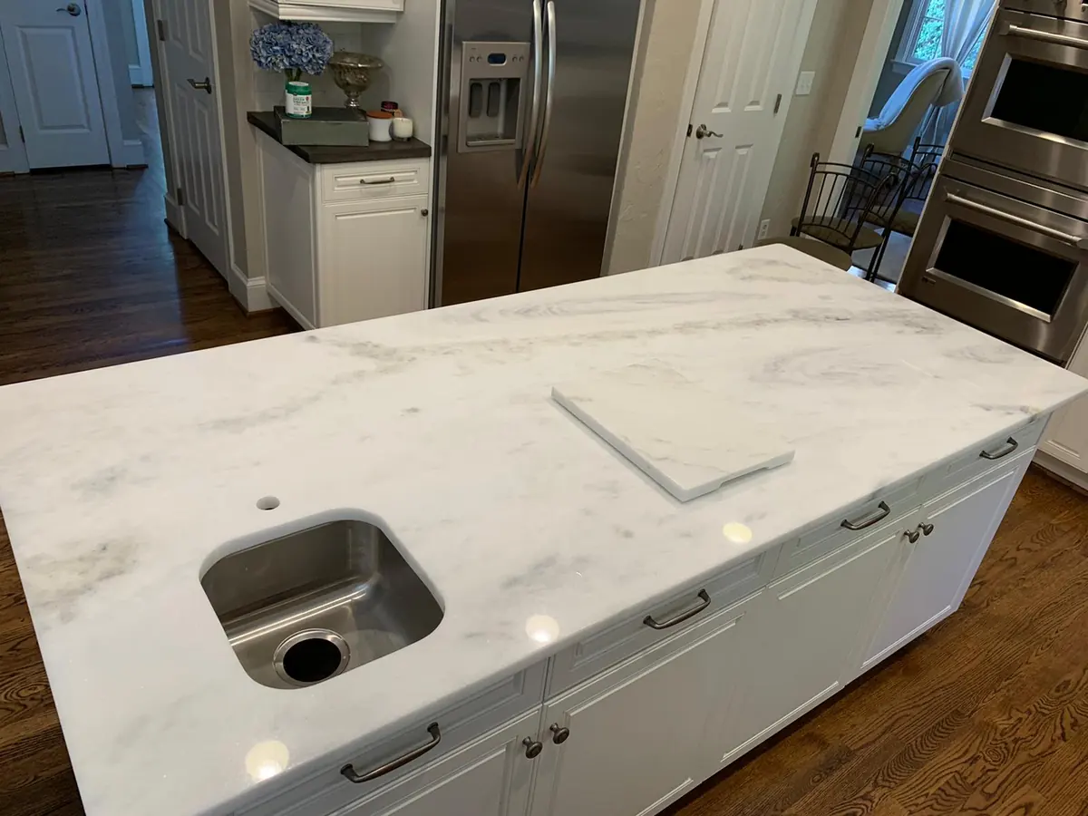 White natural stone kitchen countertop with soft gray veins
