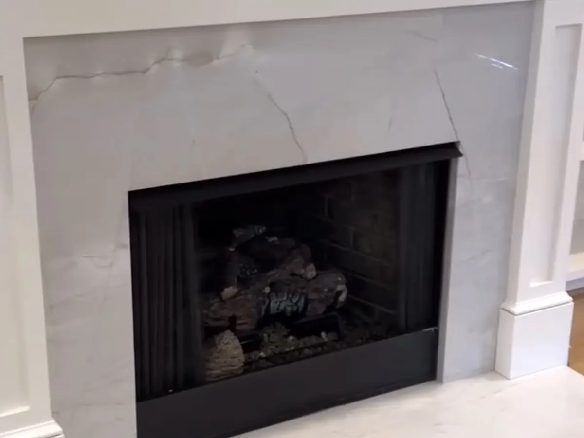White stone fireplace surround