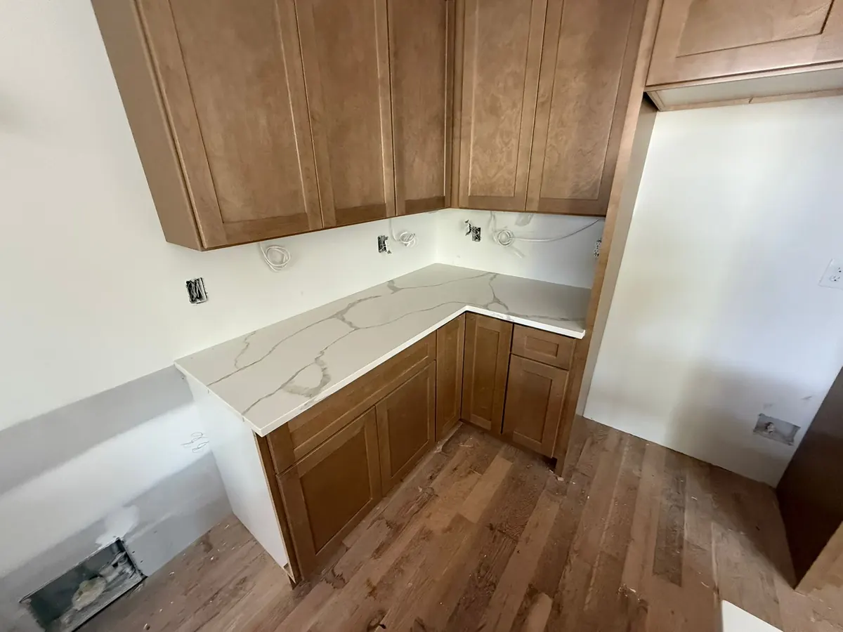 New cabinets with stone countertops in a remodeled kitchen