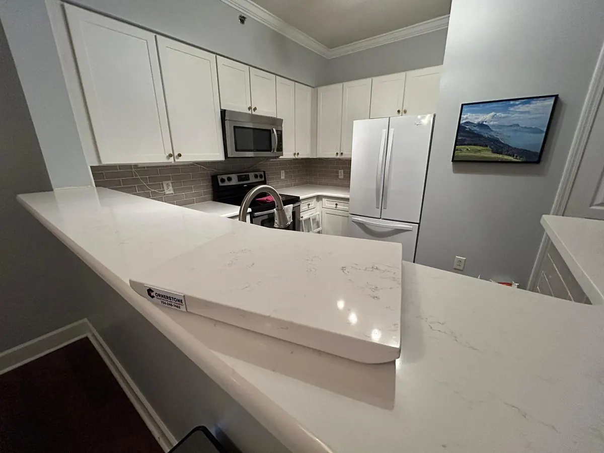 White quartz countertops in an updated kitchen