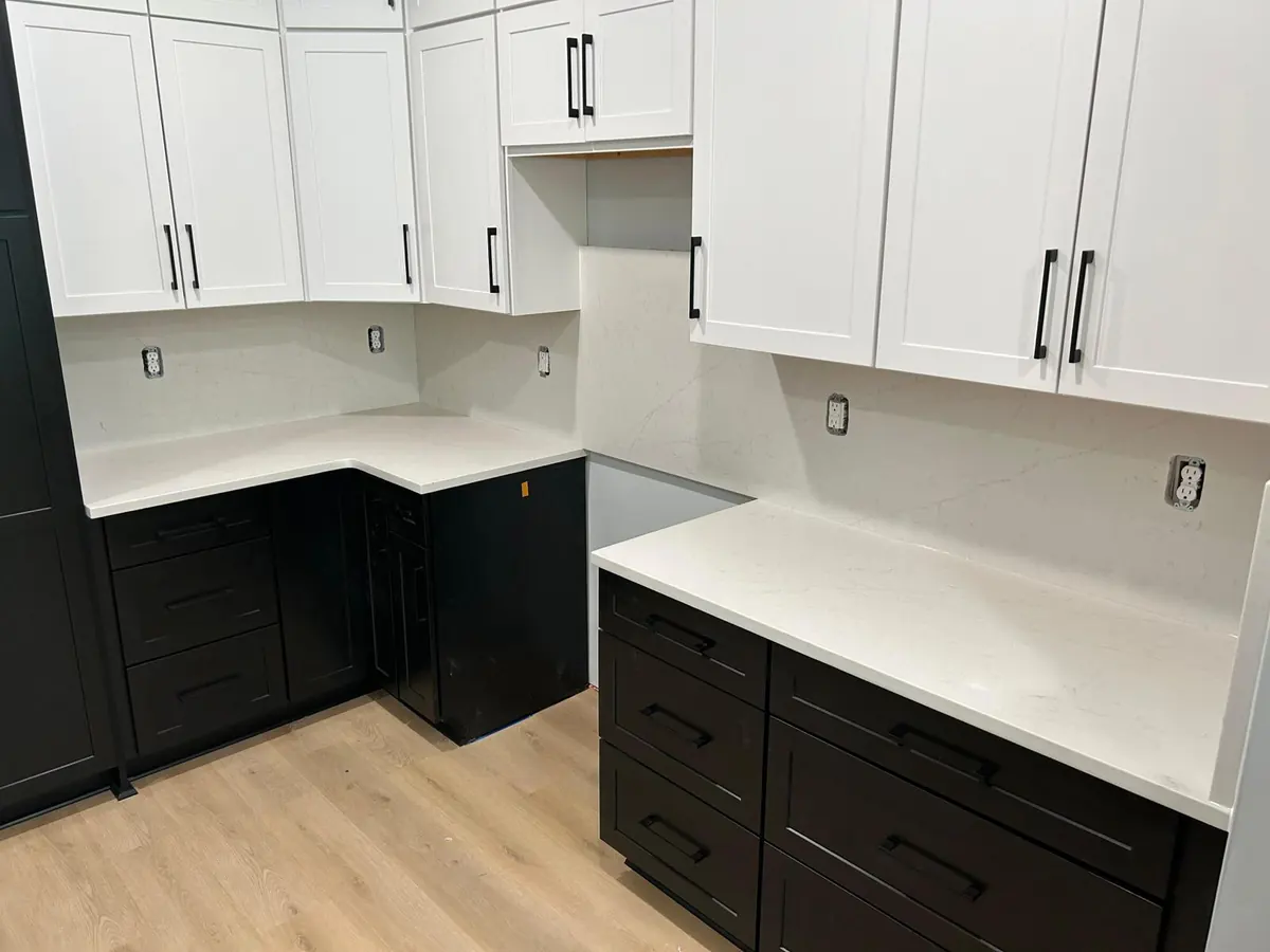 New shaker cabinets with a white stone countertop