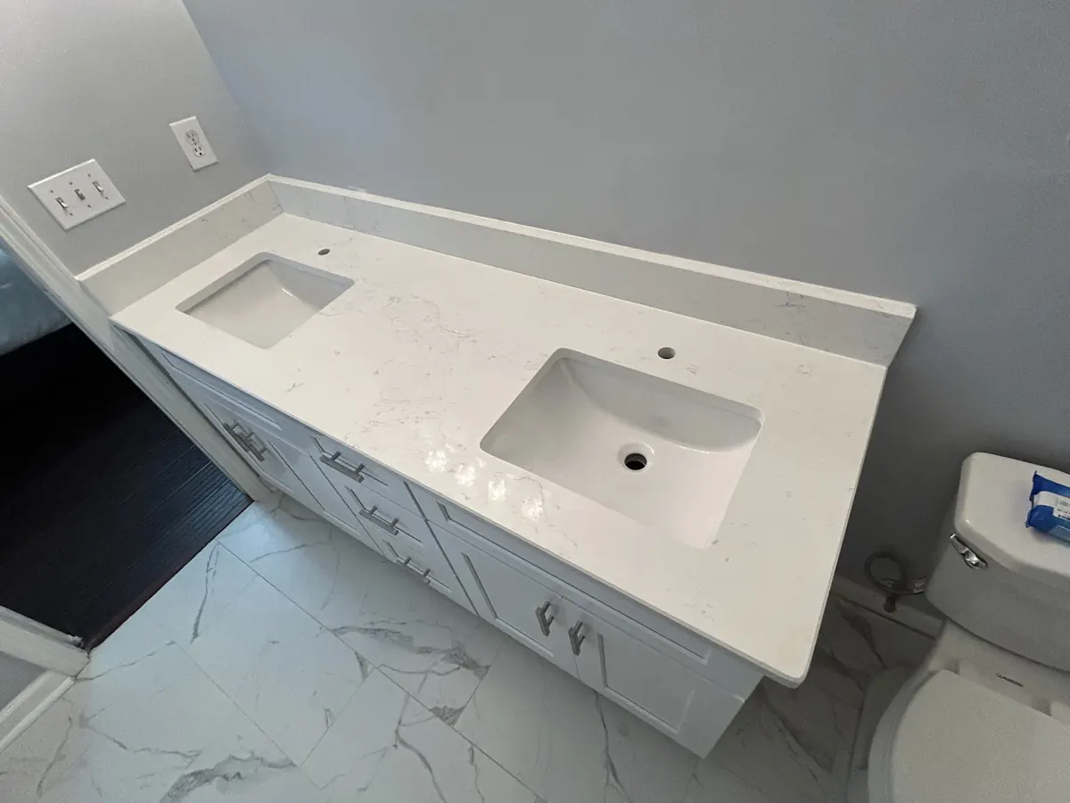 Marble-look porcelain floor in a bathroom with a new vanity top