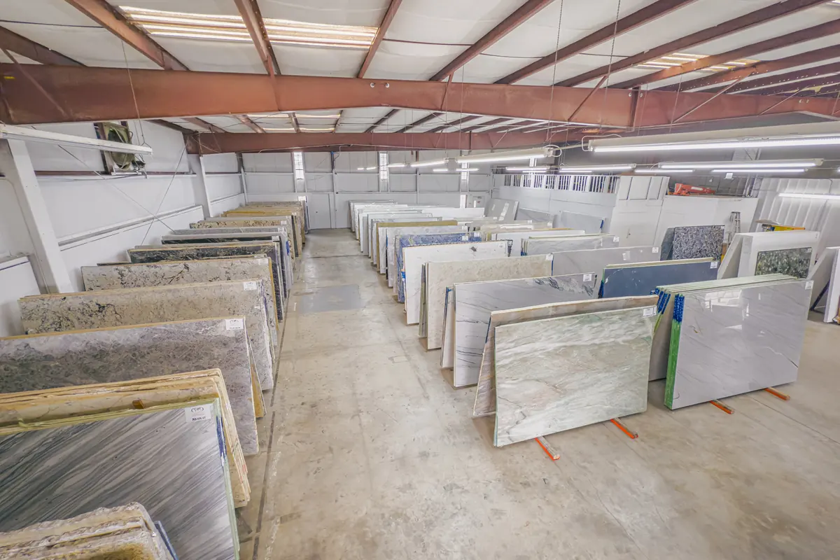 Aisle of natural stone slabs in the Cornerstone slab yard