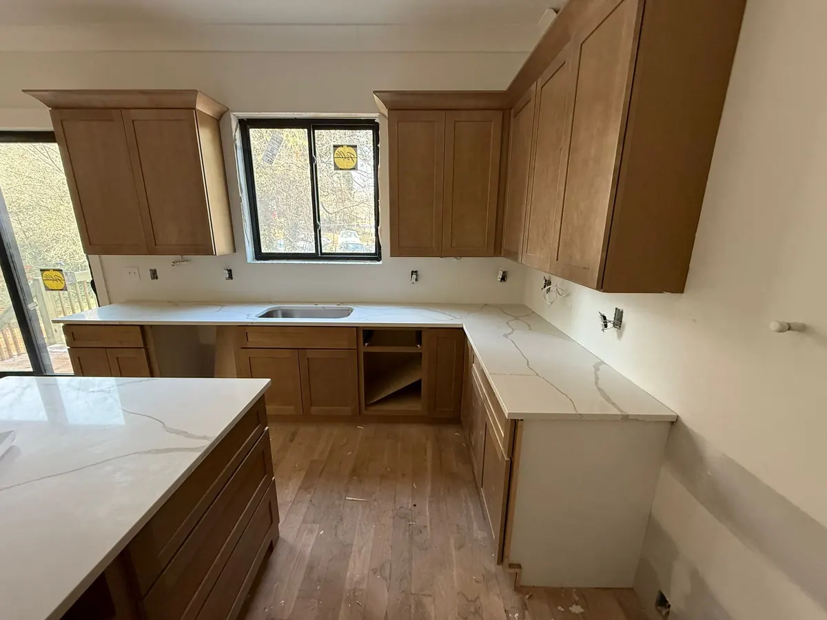 Kitchen with new cabinets and a stone countertop
